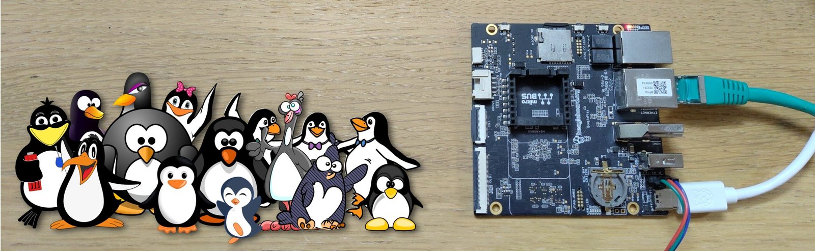 BeaglePlay board and a multitude of different penguins Photo: Michael Opdenacker Clipart: https://openclipart.org/download/189359/penguins-like-ocal.sv