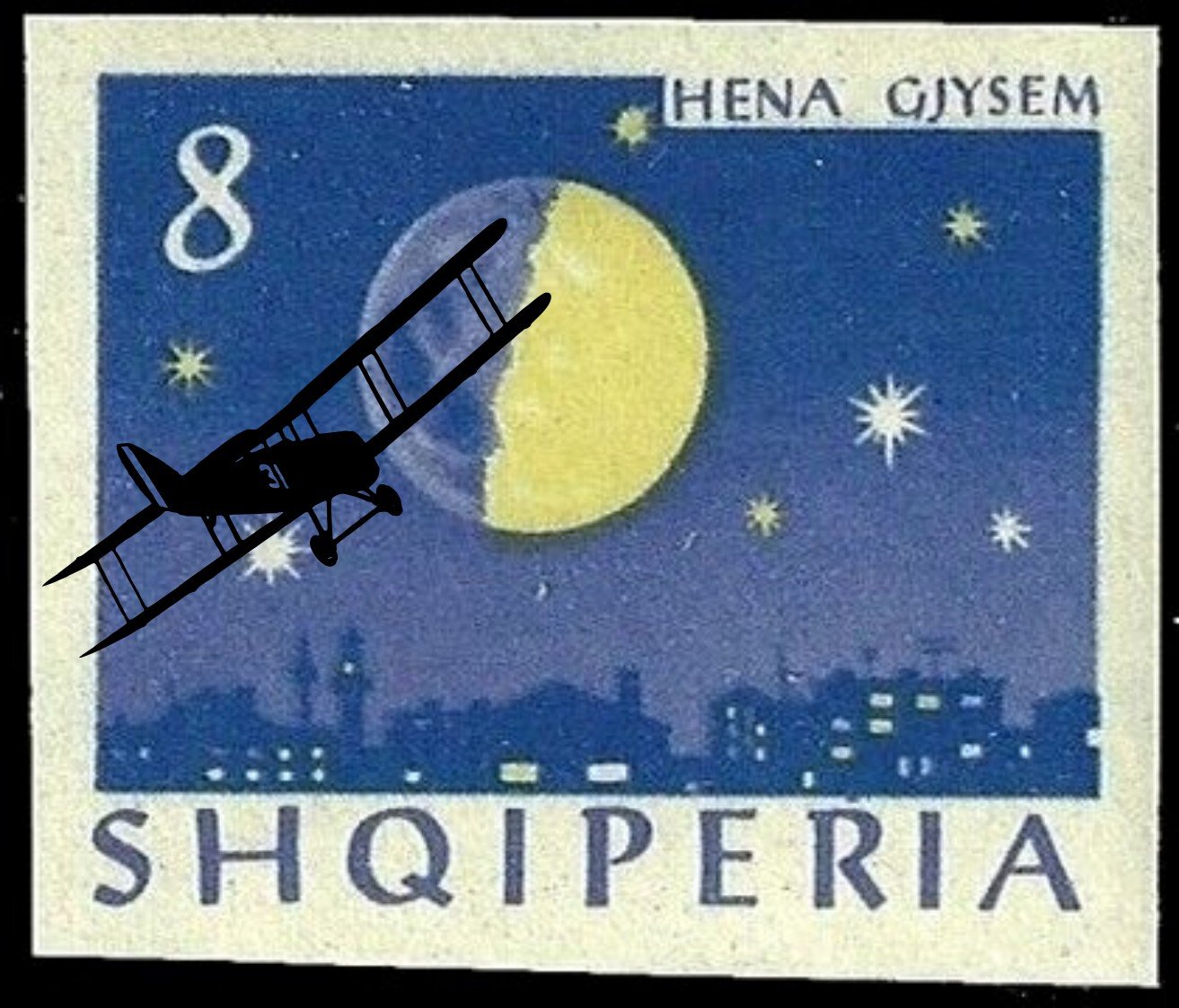 Old aeroplane flying over an Albanian moon stamp